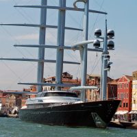 A vertical view of the magnificent Maltese Falcon super yacht moored in Venice, Italy. This clipper sailing yacht is owner by the American venture capitalist Tom Perkins and is one of the largest privately-owned sailing yachts in the world. The three carbon fibre masts are able to rotate in order to catch the wind. The boat has won a number of awards.